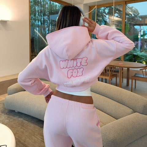 model wears pink hoodies with pink sweatpants